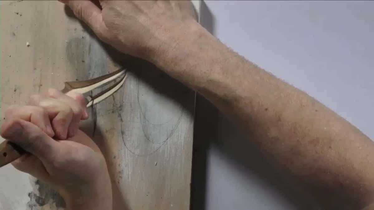 Fist and blade close up at one stroke