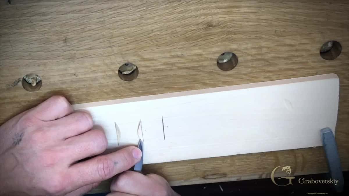 His finger braced on the knife, the way he supports it to keep the arch of that cut accurate