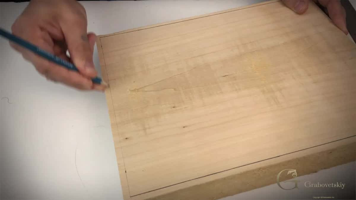 Pencil hand at the left edge