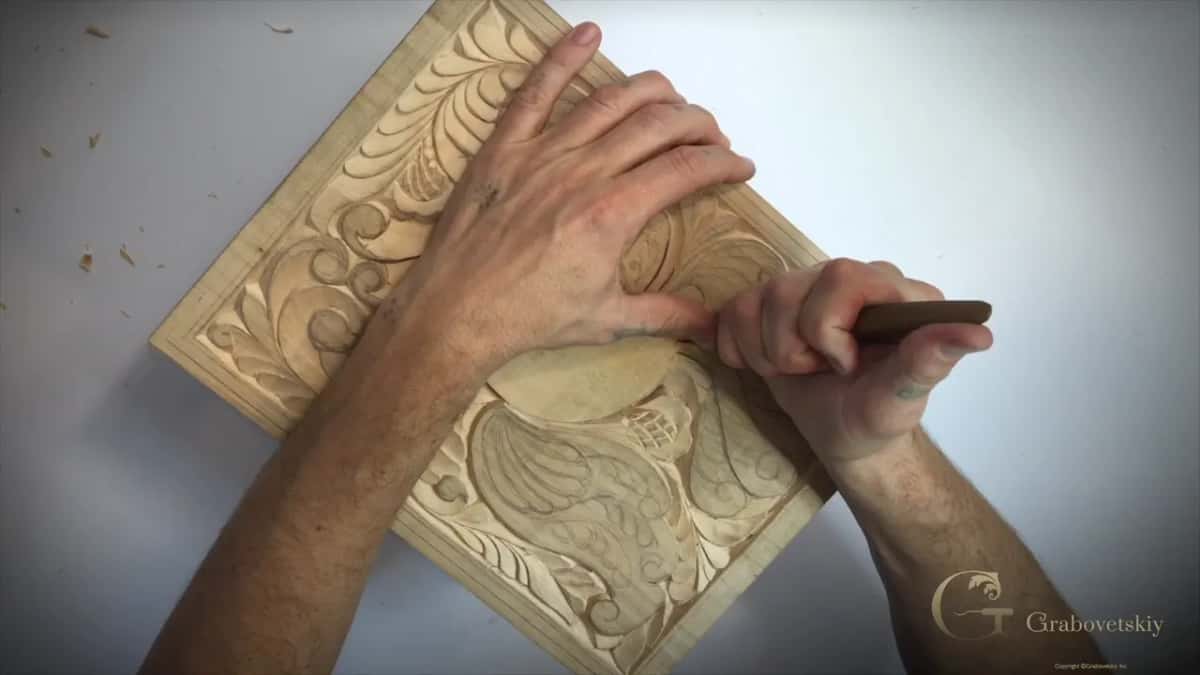 Turned board, fist and knife at its right side