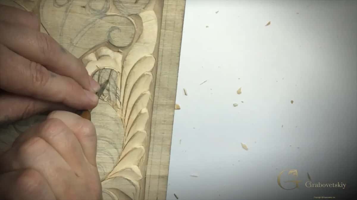 Point of the blade inside a crosshatched pencil grid close to the border