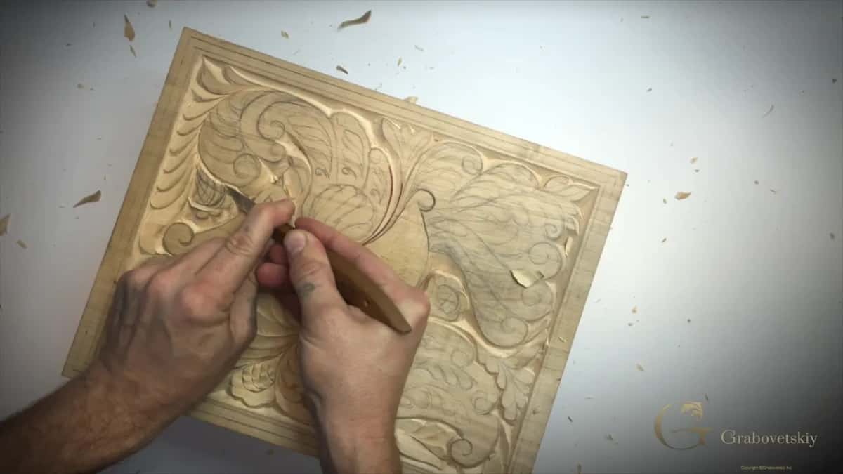 Both hands together at the upper left curls, my left thumb pushing the blade