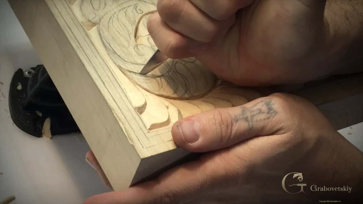Board tipped up on its edge, my knife in a curl near the corner