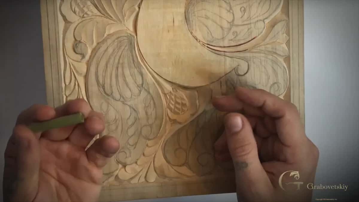 Pinched between finger and thumb