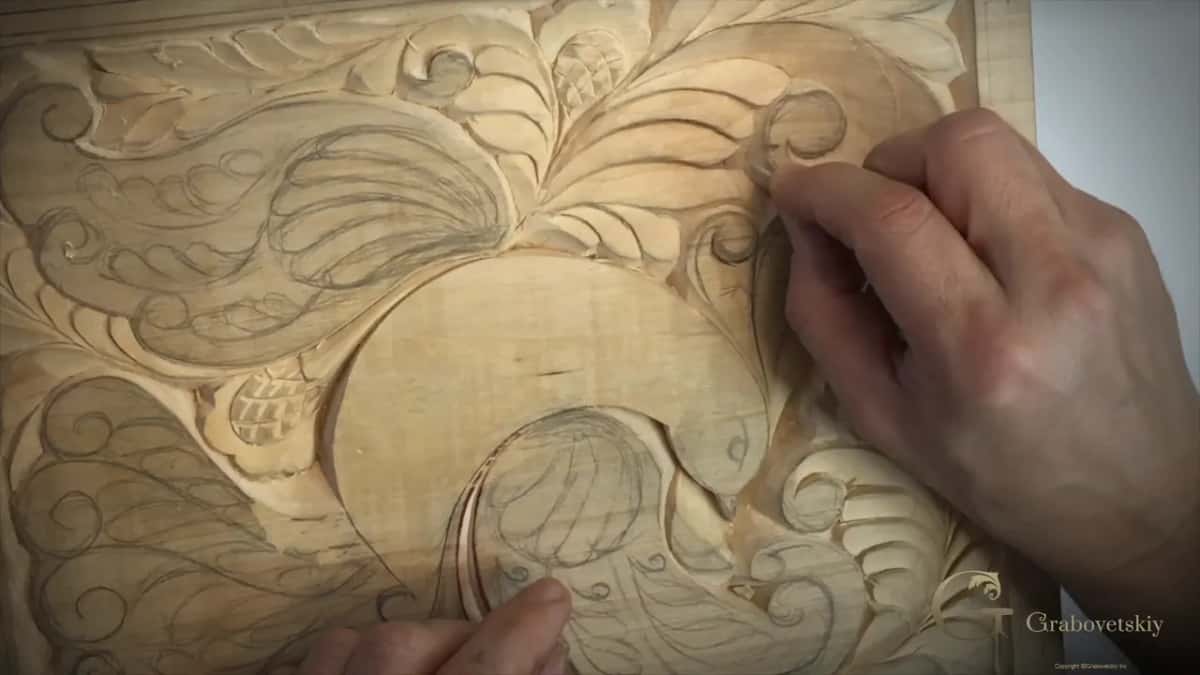 Fingers at a curl beside the head