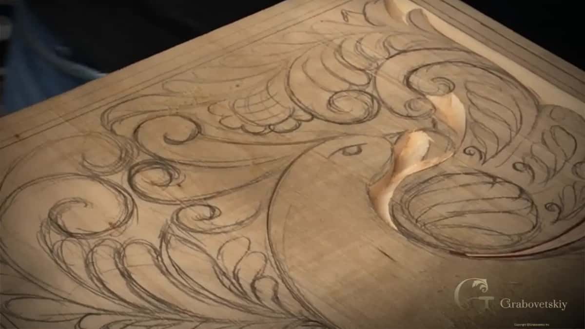 No hands in this one, only the bird with a curved channel carved round its head.