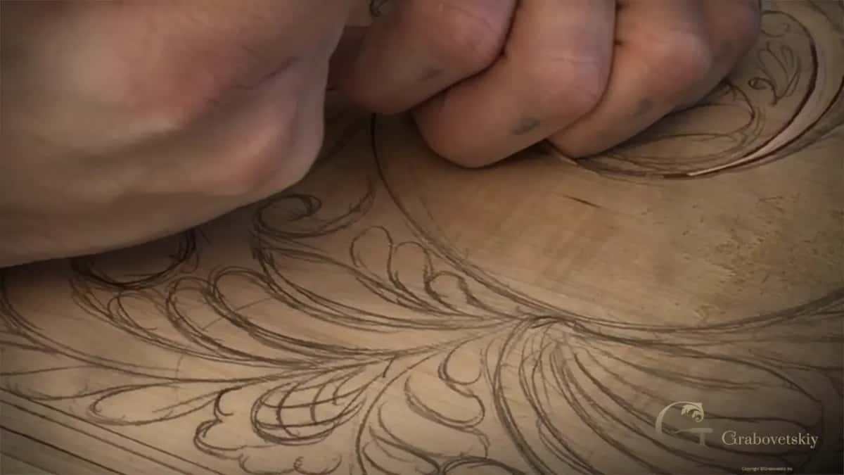 Both hands close together, the handle hidden in one fist.