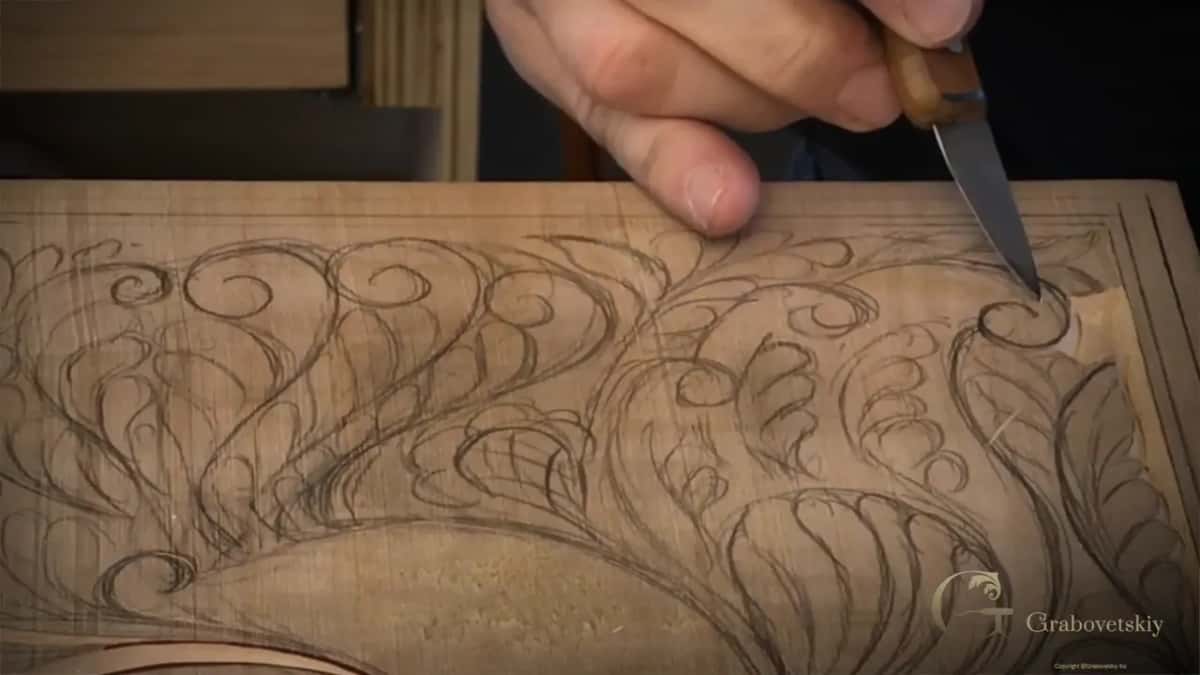 Knife tip turning a small spiral by the right-hand border.