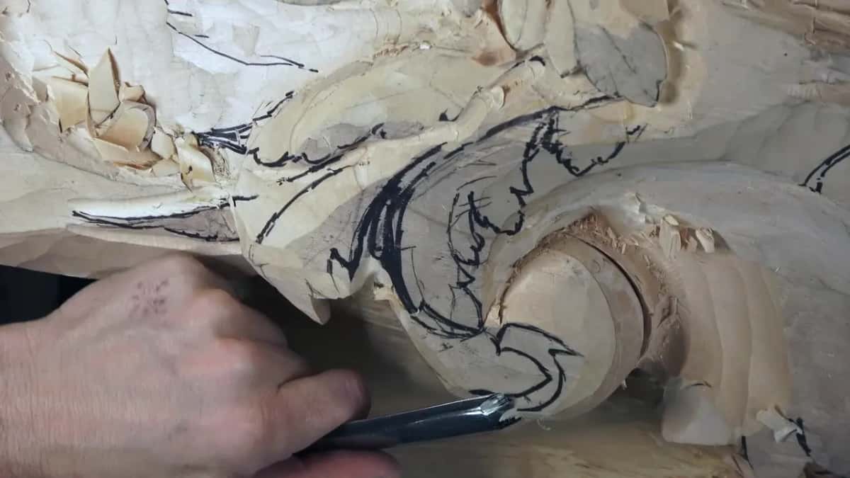 A dark handled gouge works the base of the round.