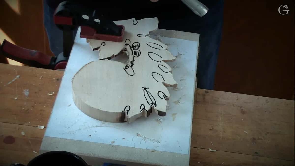 Clamp at one end, ovals and arrows drawn in black over the back