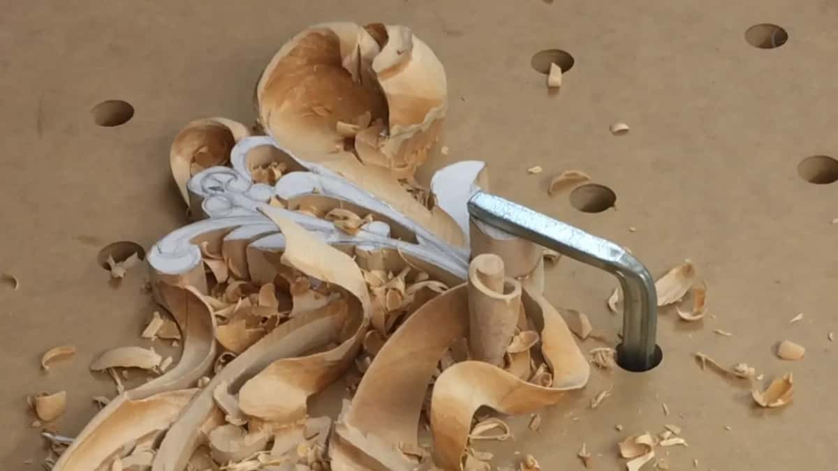 No hands now, just the carved hook and its chips