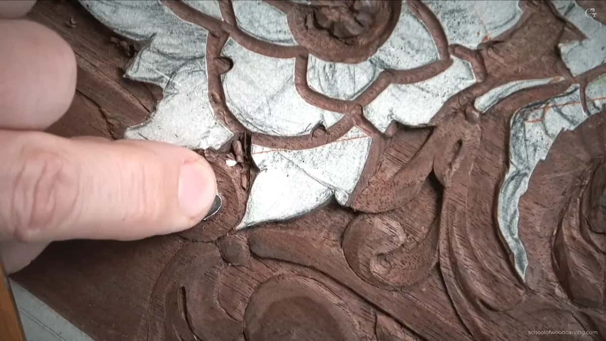 His thumb tip on the volute