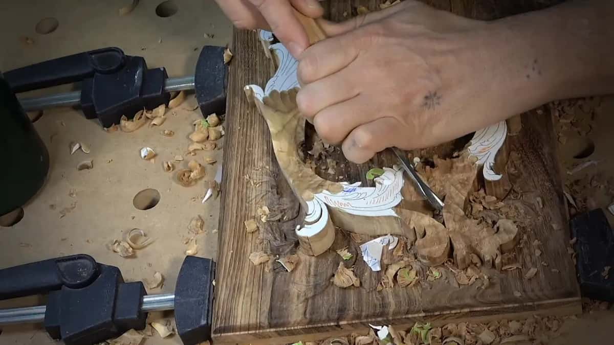 Both hands on one tool at the curly spot