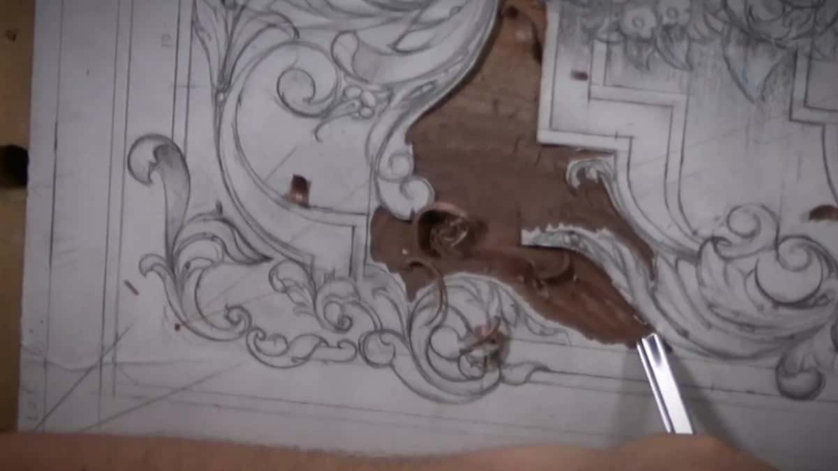 Brown wood opened up beside the white paper, the wall between them standing straight
