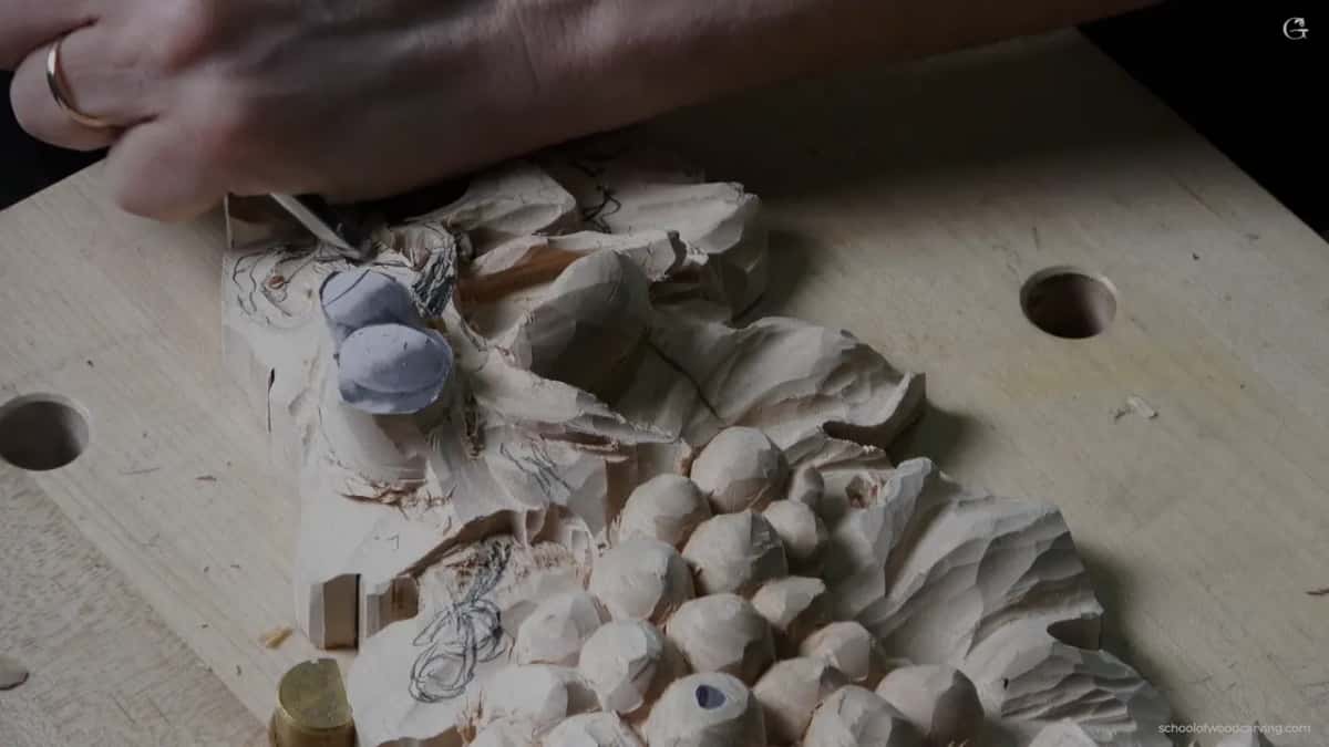 Small blade going in beside grey clay pieces