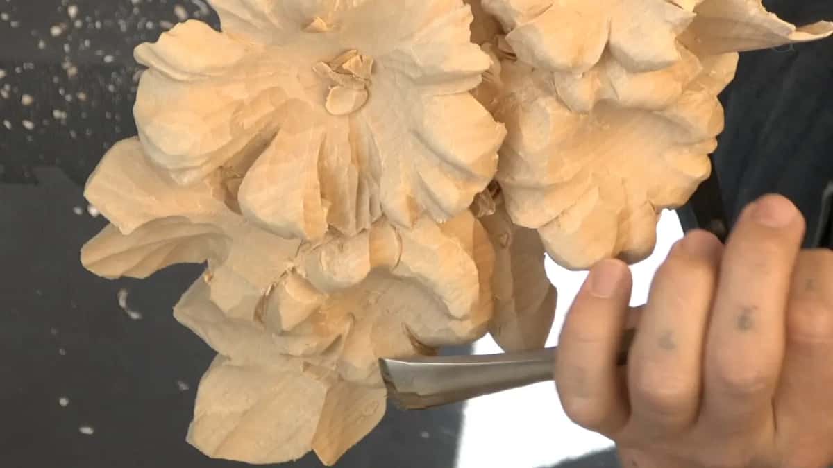 Panel upright, wide gouge below the lower flower