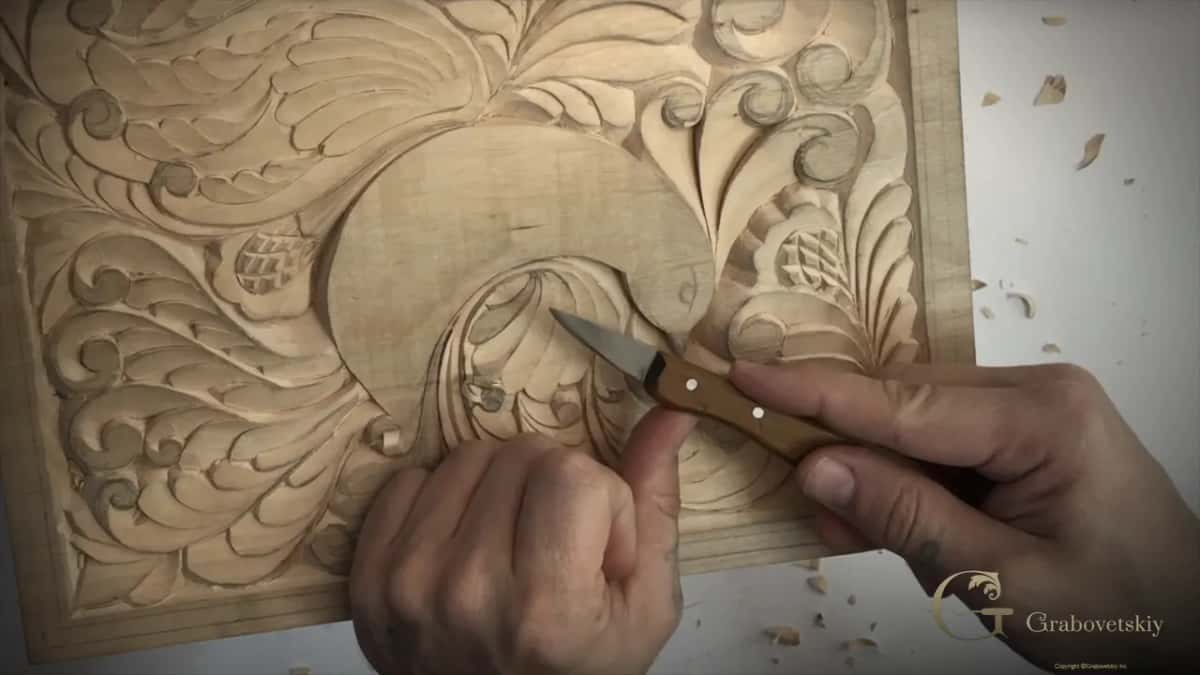 Thumb on the back of the blade