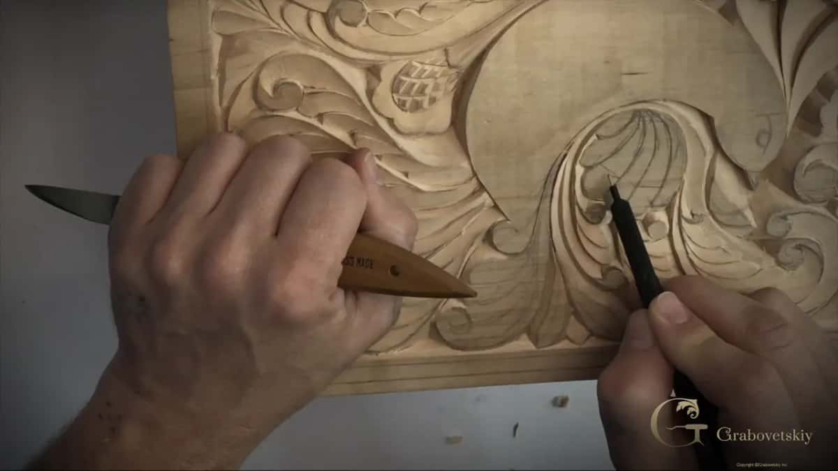 Pen and knife over one curl