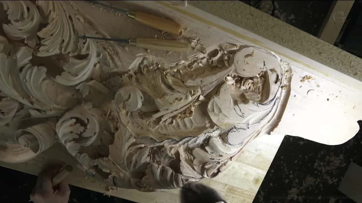 Acanthus scroll from above, two gouges resting beyond it