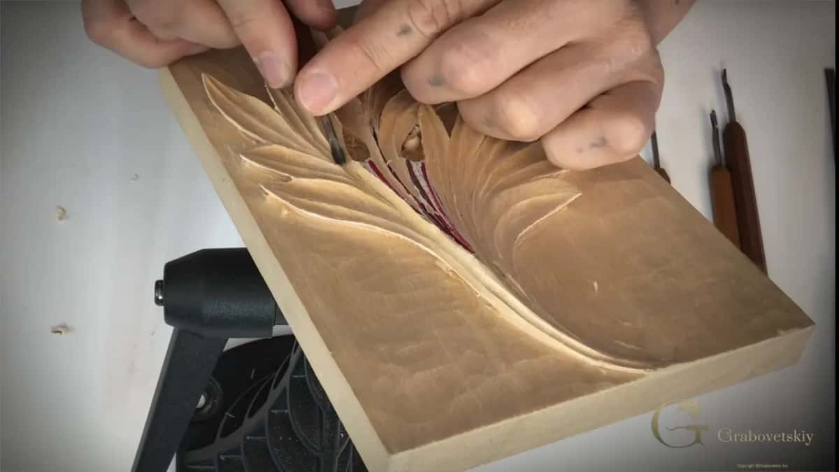 A small tool at one eye, panel tilted.