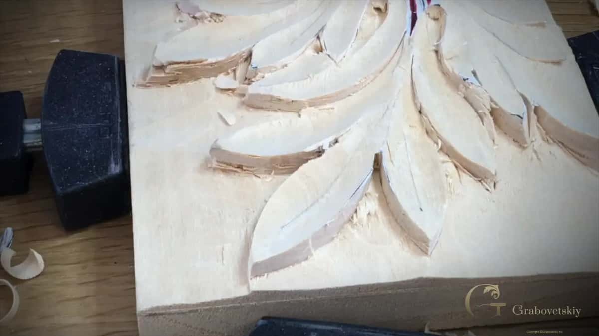 A low view along the clamped panel shows each lobe standing up from a rough ground, with red at the top.
