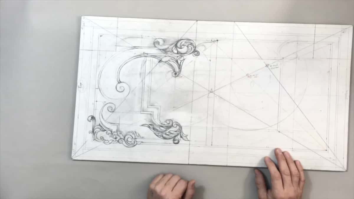 Whole drawing laid out flat with both hands resting at the near edge