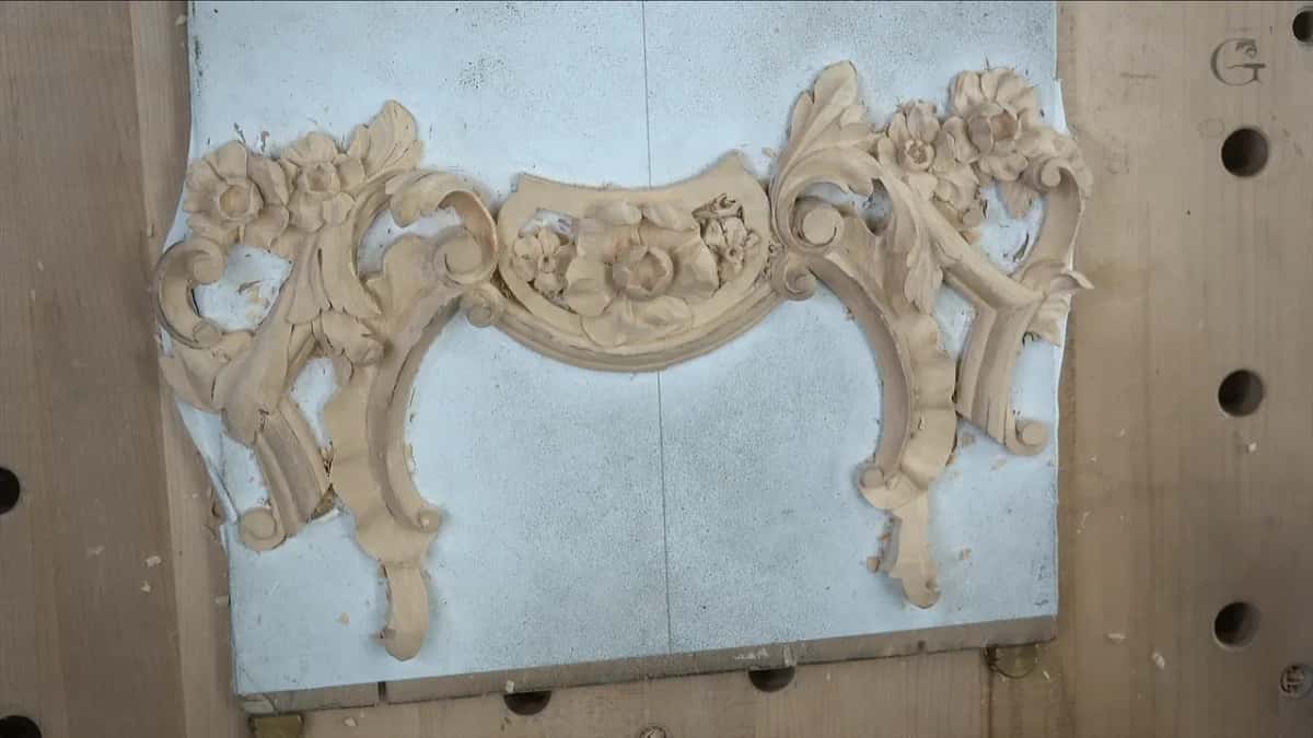 Carved piece resting on its white board