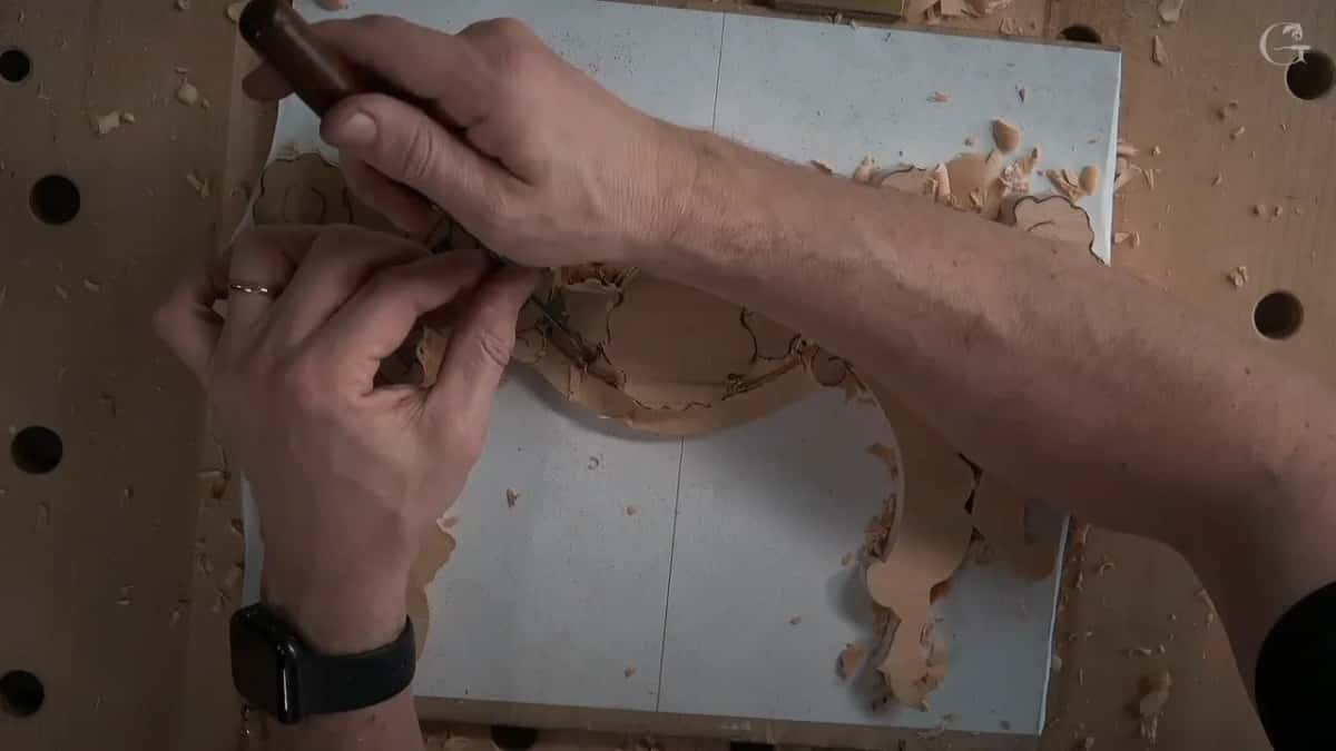 Left fingers pinch the steel near its edge while the right hand steers the handle