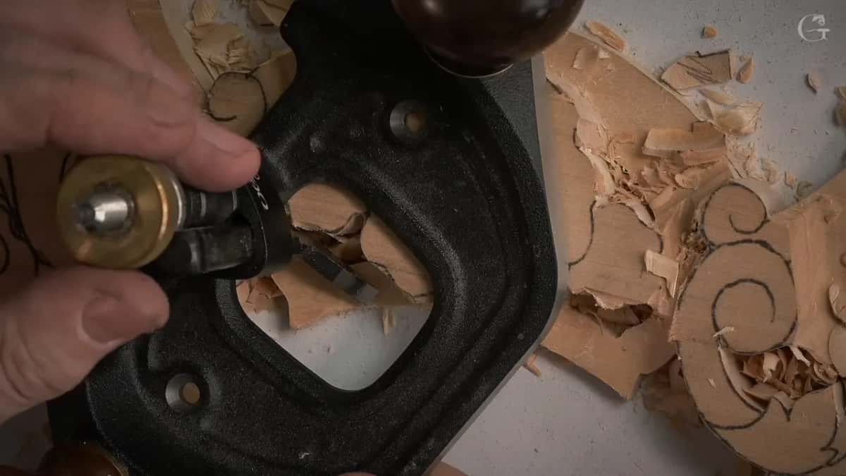Fingers on the router plane's brass knob