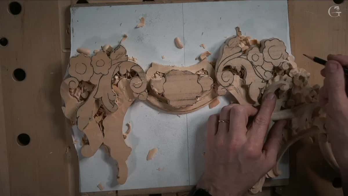 Pencil ready, the finished piece laid over the edge of the new one