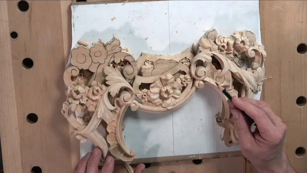 The finished first panel, a pencil at its right scroll
