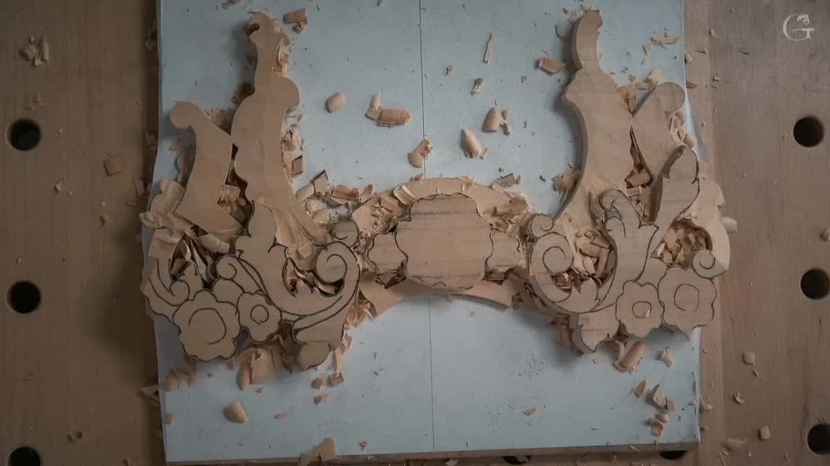 The roughed piece from above, chips lying in its hollows
