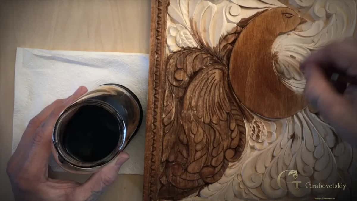 Jar on a paper napkin, the bird already brown and the leaves on the right still bare