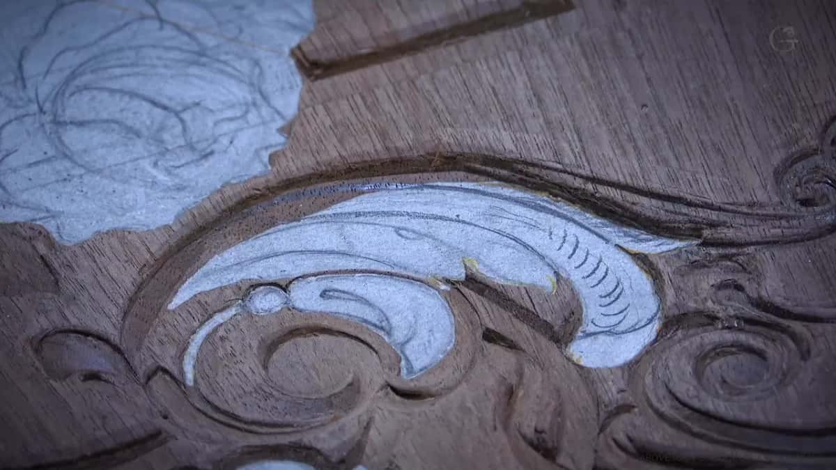 Paper still glued to the carved shape