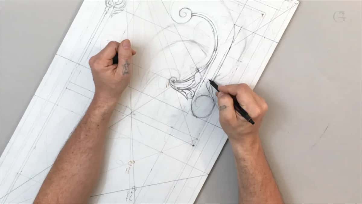 Left hand holding the sheet still while the right one draws next to a small circle