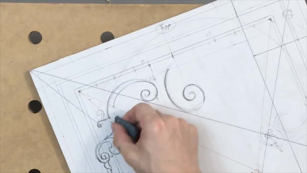 Eraser in the right hand at the leafy corner, two spirals above it