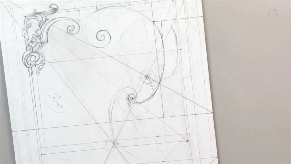 The corner scrolls at top left, the oval note at left and a spiral of arcs in the middle