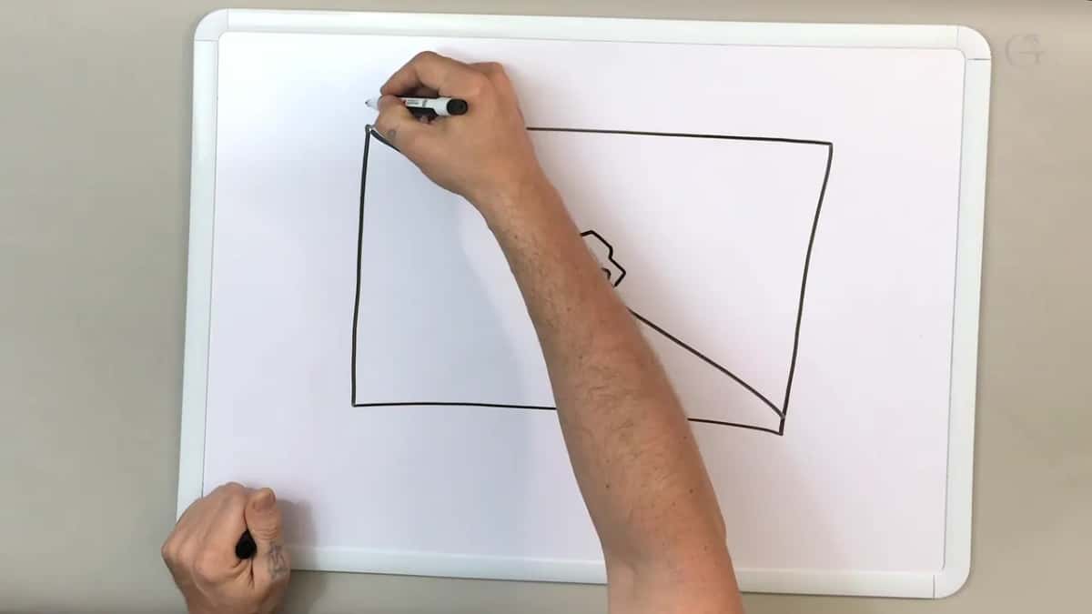 Marker at the top left corner of the drawn box, a small car half hidden behind the arm on the falling line