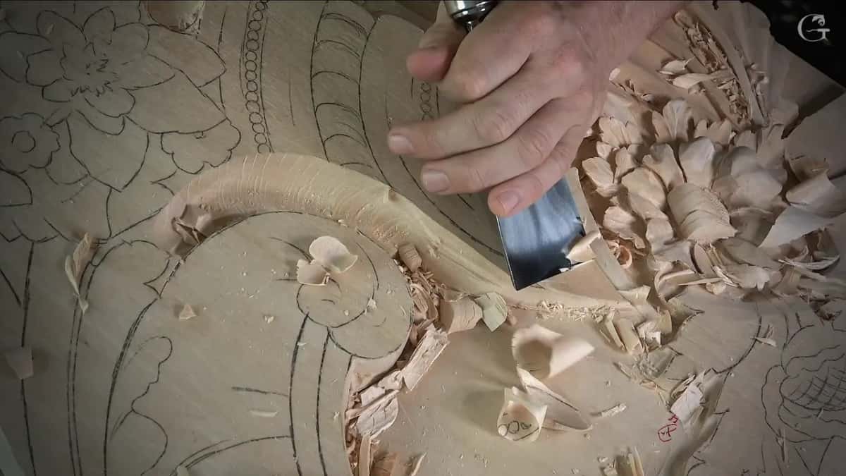 Wide flat blade near carved leaves