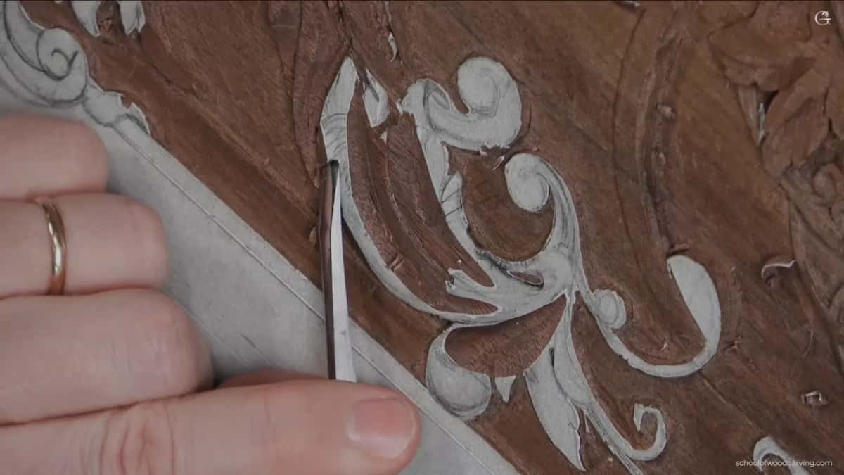 Slim steel at the left side of the scroll, a ring on the hand