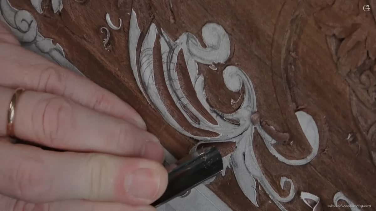 Ring hand and a dark gouge, lower left