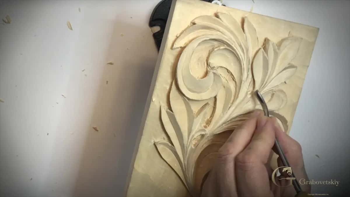 Panel stood on end, a curved tip working under the right-hand leaves
