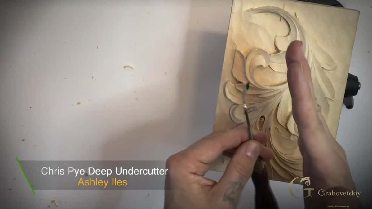 Caption reading Chris Pye Deep Undercutter and Ashley Iles, one hand on the tool and the other flat