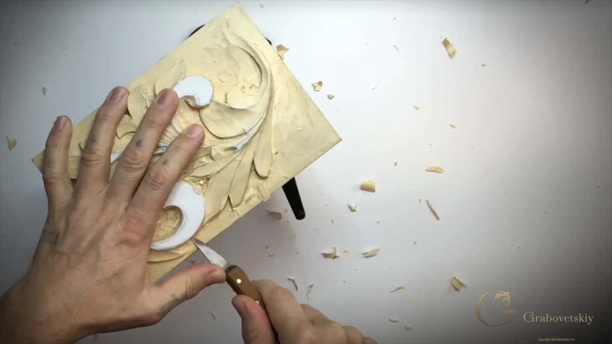 Chips around the panel and a knife on the bottom curl