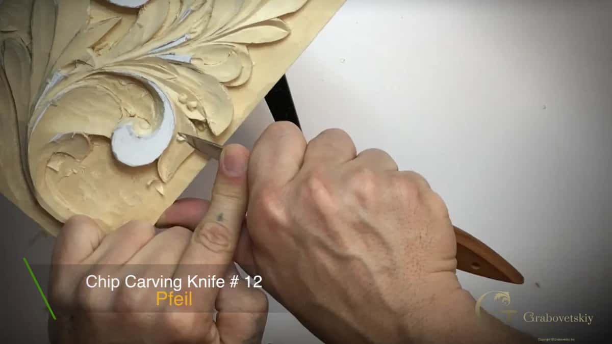 On-screen card naming a number 12 chip carving knife as the knife works at the lower curl