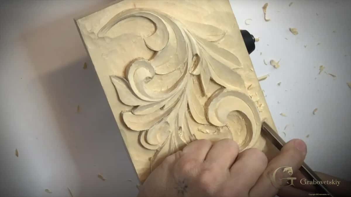 Fingers round a handle, lower right