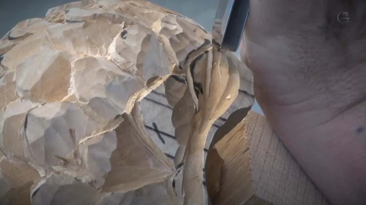 Close on the roughed ball, a few marker lines left and a blade going in at the upper right