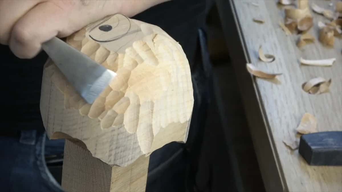 Wide, nearly flat gouge against the scalloped curve of the ball on its block