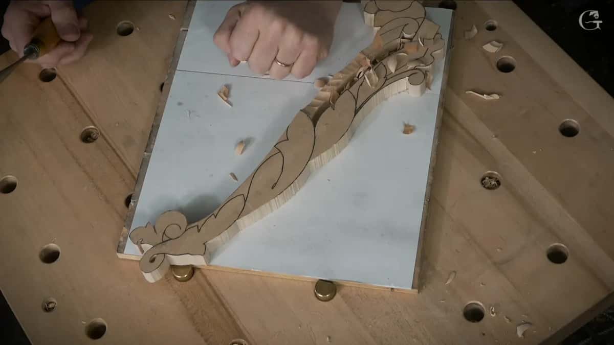 From above, the blank lies corner to corner on its white papered board, one fist pressed on it