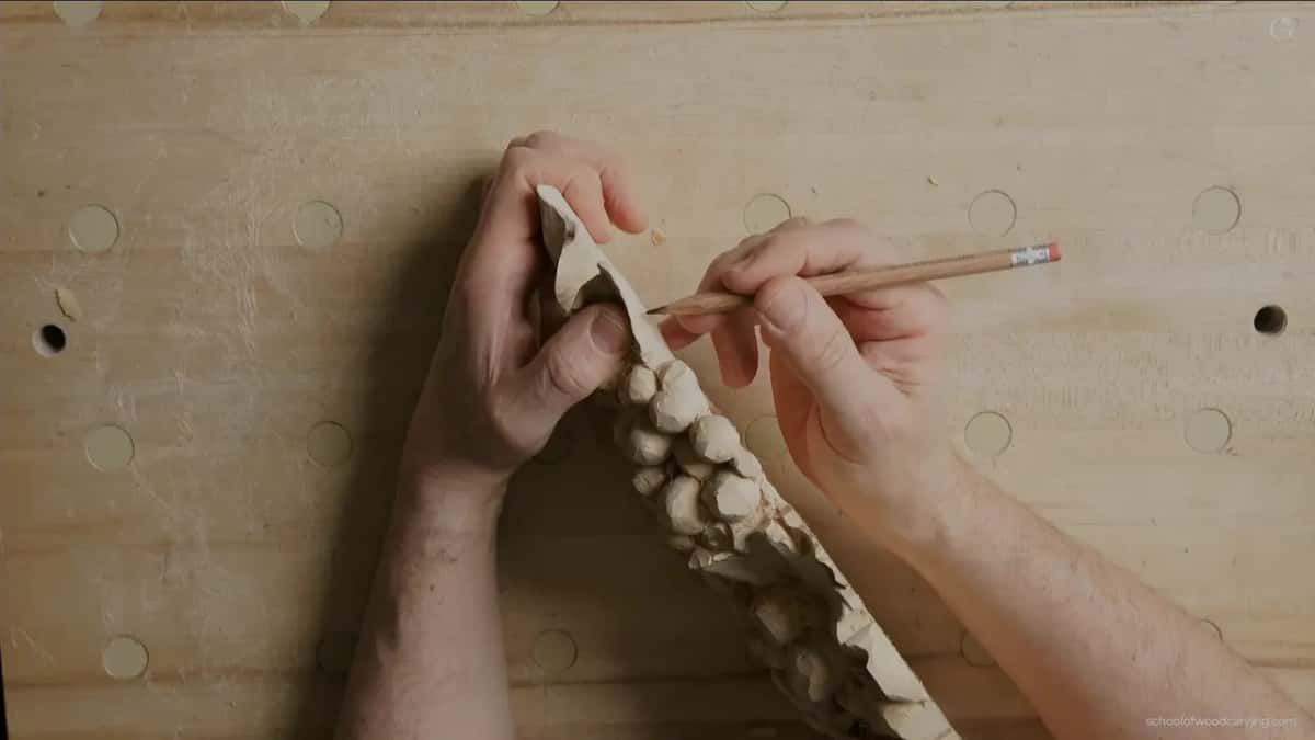 Pencil pointing at the onlay's edge while it stands on its side